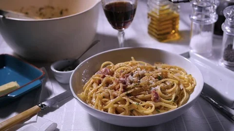 Slow motion view: grating parmesan cheese over spaghetti carbonara Stock Footage 73528295
