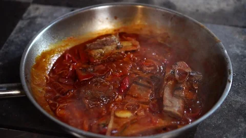 Slow motion view on hot white steam coming up from frying pan with delicious Stock Footage 106978459