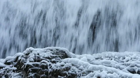 Slow motion view of icy cold frozen waterfall Видео 59849212