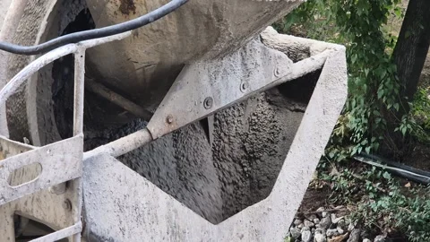 Slow motion view inside rotating concrete mixer truck drum Video stock 343412970