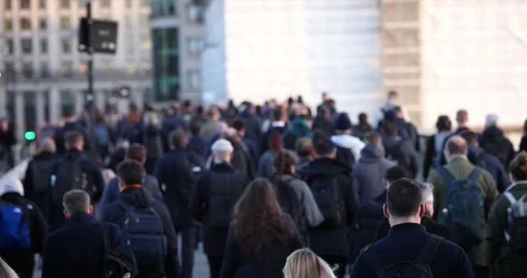 Slow motion view of a large crowd of commuters going to work in the City Video stock 263653913