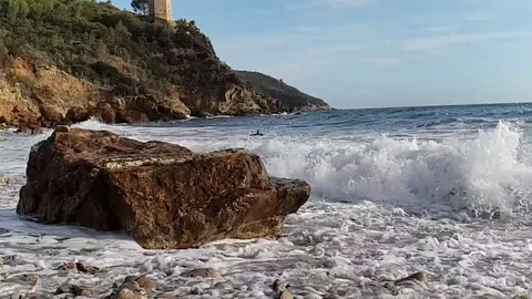 Slow motion view of a lonely bay in a sunny summer morning with rough sea Stock Footage 120247525