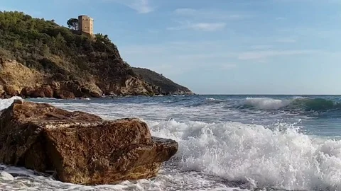 Slow motion view of a lonely bay in a sunny summer morning with rough sea Stock Footage 120247531
