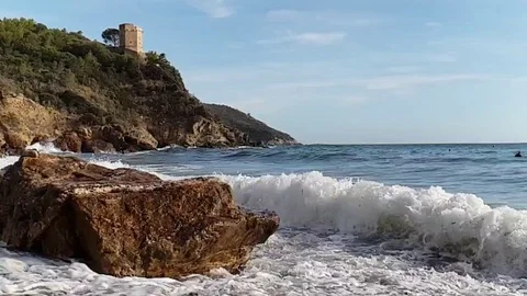 Slow motion view of a lonely bay in a sunny summer morning with rough sea Stock Footage 120247569