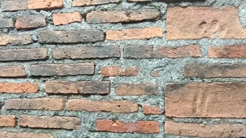 Slow motion view of the old destroyed red brick wall Stock Footage 162230594