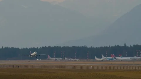 Slow motion view of passenger airplane taking off Stock Footage 174802112