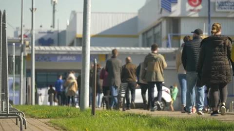 Slow motion view of people standing in the line for vaccination from Covid-19 Stock Footage 154054660