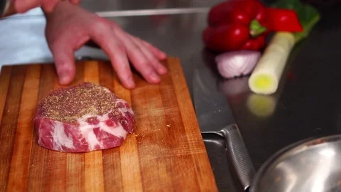 Slow motion view on process of marinating thick beef slice raw steak meat with Stock Footage 105457003
