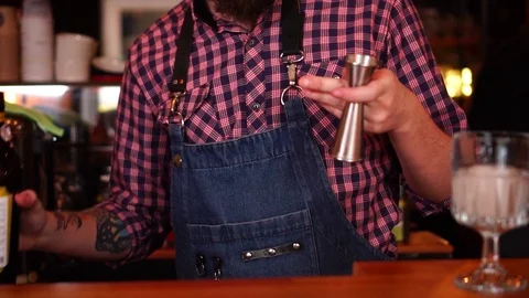Slow motion view on professional tattooed male bartender preparing alcohol Stock Footage 103746266