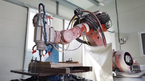 Slow motion view of robot working on milling sculpture in natural stone Stock Footage 329216203