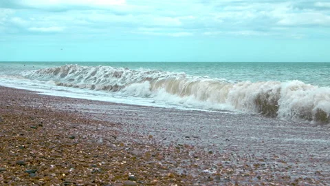 Slow-motion view of sea waves on a cloudy and windy day in 4K. Stock Footage 134608878