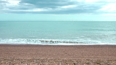 Slow-motion view of sea waves on a cloudy and windy day in 4K. Stock Footage 134634998