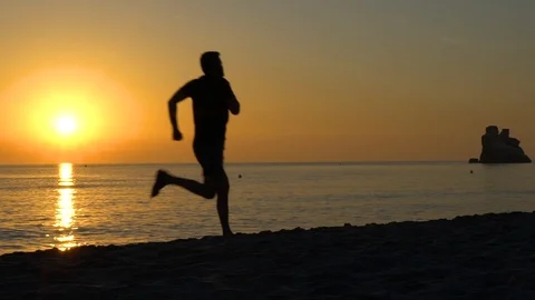 Slow motion view of the silhouette of running man Stock Footage 110904244