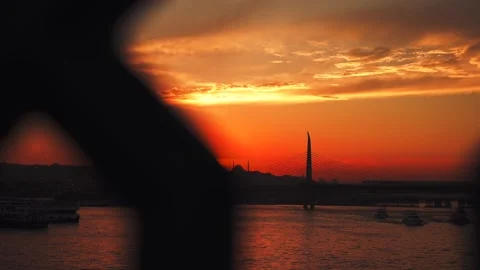 Slow motion view through the fence of the Galata bridge to the Golden Horn at Stock Footage 248212437