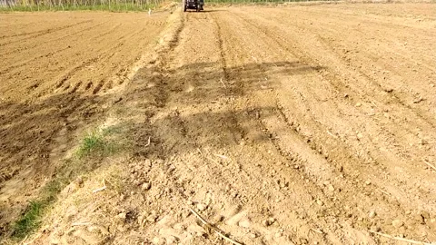 Slow motion view of tractor in the field. Stock Footage 142950466