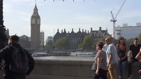 Slow motion view of traffic and pedestrians passing on Westminster Bridge Stock Footage 260022009