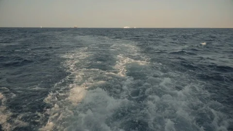 A slow motion view of the wake behind a large cruise ship at sea. Stock Footage 99009424
