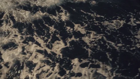 A slow motion view of the wake behind a large cruise ship at sea. Stock Footage 99009969