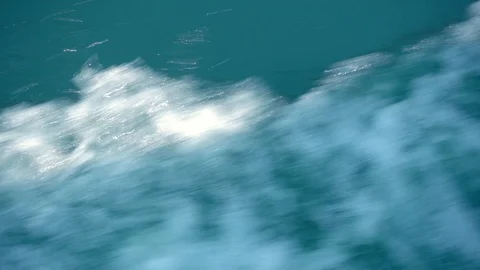 A slow motion view of the wake behind a large cruise ship at sea. Stock Footage 99012755