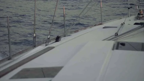 Slow motion view of water and waves of sea from sailing yacht Stock Footage 104293736