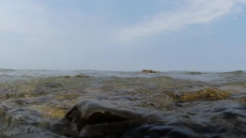 Slow motion view of waves hitting camera Stock Footage 160971808