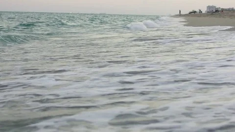 Slow motion view of waves rolling onto the beach Stock Footage 72320353