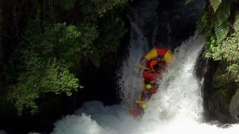 Slow motion view whitewater rafting over waterfall in Rotorua, New Zealand Stock Footage 87900682