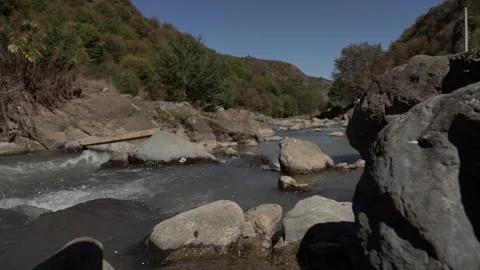 Slow Motion view of Wild Mountain River With Stones and Rocks Stock Footage 255007708