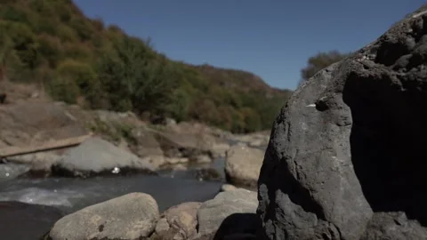 Slow Motion view of Wild Mountain River With Stones and Rocks Stock Footage 255007729