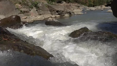 Slow Motion view of Wild Mountain River With Stones and Rocks Stock Footage 255007735