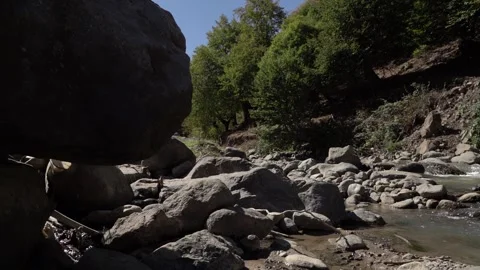 Slow Motion view of Wild Mountain River With Stones and Rocks Stock Footage 255007820
