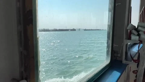 Slow motion view from the window of a ship in a sunny day Stock Footage 237959629