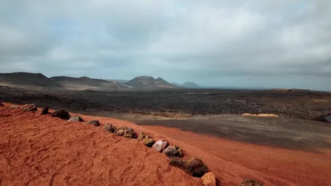 Slow motion volcanic landscape of Timanfaya National Park, Lanzarote, Canary Stock Footage 346376741