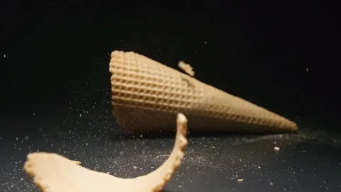SLOW MOTION: Waffle cone falls and breaks Stock Footage 72496300