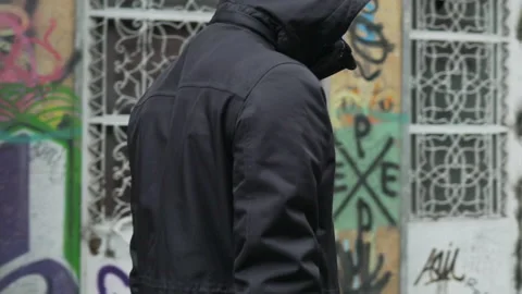 Slow motion walk of man wearing a mask Stock Footage 134460771