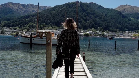 Slow Motion Walk On Small Queenstown Pier, New Zealand Stock Footage