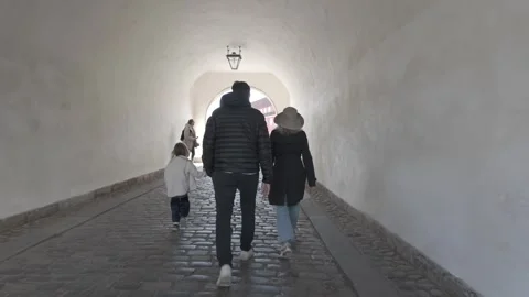 Slow motion walk through the vaulted stone gate tunnel of Kastellet citadel Stock Footage 341289182