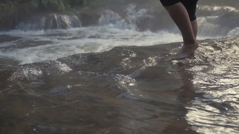 Slow motion - walking in hot spring stream, Rotorua, New Zealand Stock Footage 96023567