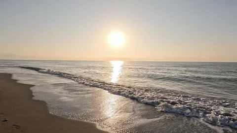 Slow motion walking the seaside watching the sunrise Vídeos de archivo 342494458