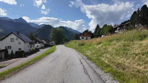 Slow motion walking shot through a picturesque Austrian mountain village Stock Footage 344890351