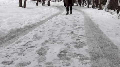 Slow motion walking in the snow Stock Footage 145280392