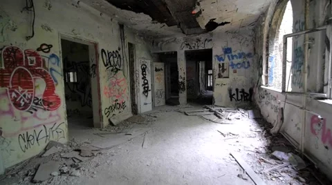 Slow motion of walking through abandoned building with graffiti Stock Footage 58615151