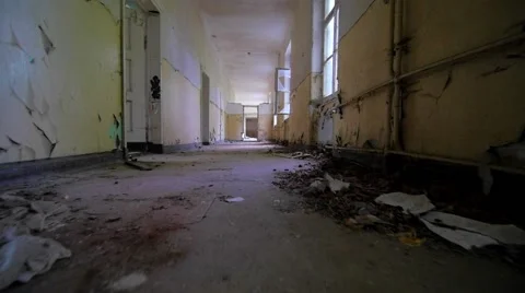 Slow motion walking through a cracked abandoned building 스톡 동영상 58615322