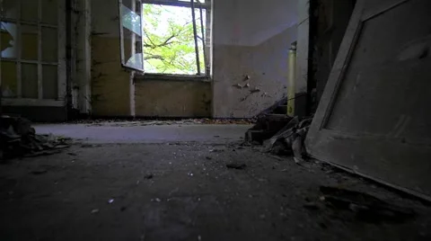Slow motion walking through a cracked abandoned building 스톡 동영상 58615542