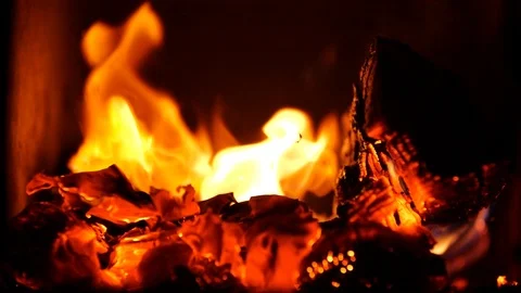 Slow motion of Warm cozy burning Fireplace. Beautiful Hot Rising Sparks from Stock Footage 121240064