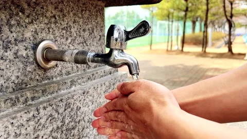 Slow motion, wash your hands on the waterfront Stock Footage 175818657