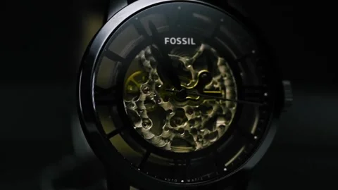 Slow motion of watch with golden elements camera, moves in and around