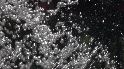 Slow motion of water boiling with plenty bright air bubbles in bowl Stock Footage 100239148