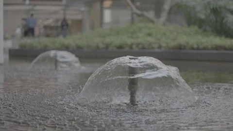 Slow-motion water bubbles and splashes in outdoor fountain. Stock-Footage 330239692