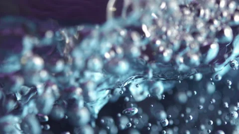 Slow motion of water bubbles in purple and blue colors Video stock 234509075